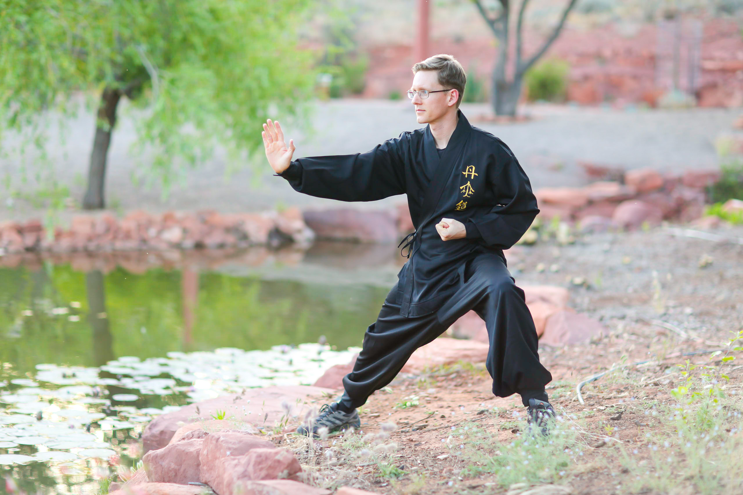 Instructor Travis guiding tai chi